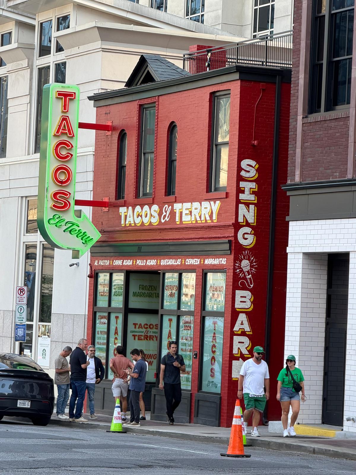 Tacos El Terry Nashville red brick building with neon TACOS sign and Sing Bar painted on exterior at 111 4th Avenue South one block from Broadway