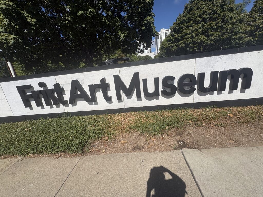 Frist Art Museum exterior signage with downtown Nashville skyline visible in background